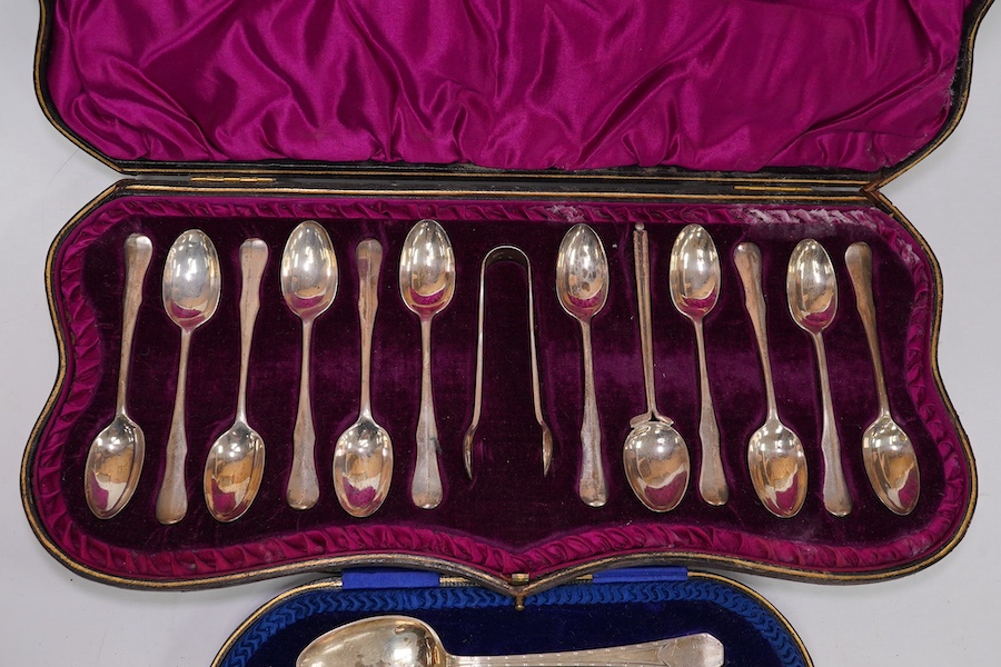 A cased Edwardian silver Christening trio, by Henry Wigful, Sheffield, 1909 and a cased set of eleven Edwardian silver coffee spoons and pair of sugar tongs, London, 1901/2 and one odd silver golf related teaspoon. Condi